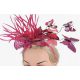  Un meraviglioso fascinator rosa con una stravagante fascia a farfalla primaverile